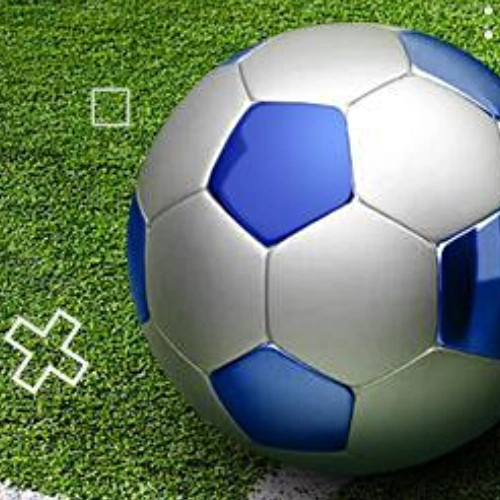 Football resting on the grass of a stadium pitch — France. Ligue 1 2026